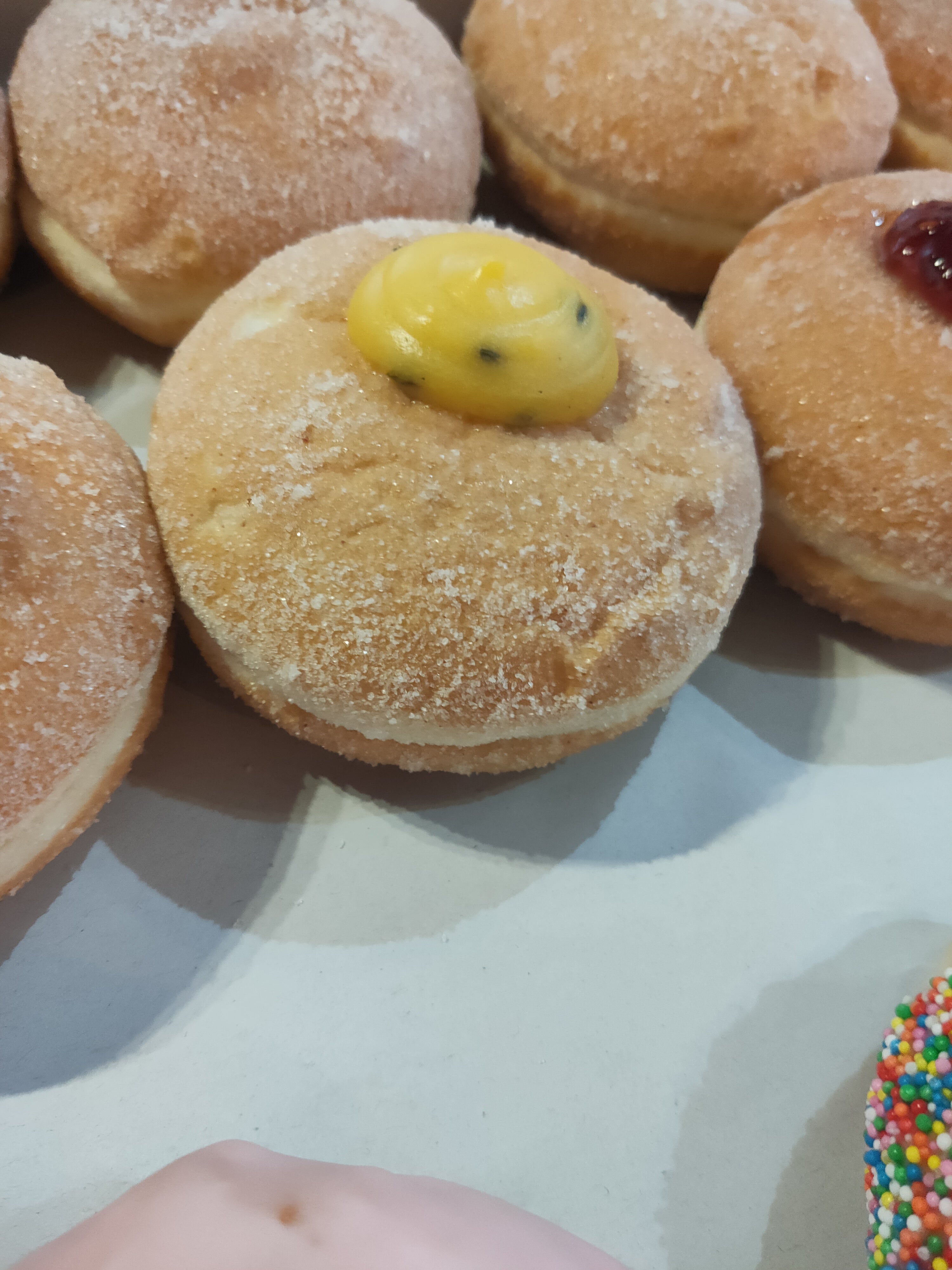 Large passionfruit custard donut