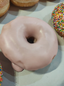 Large strawberry glazed Ring donut